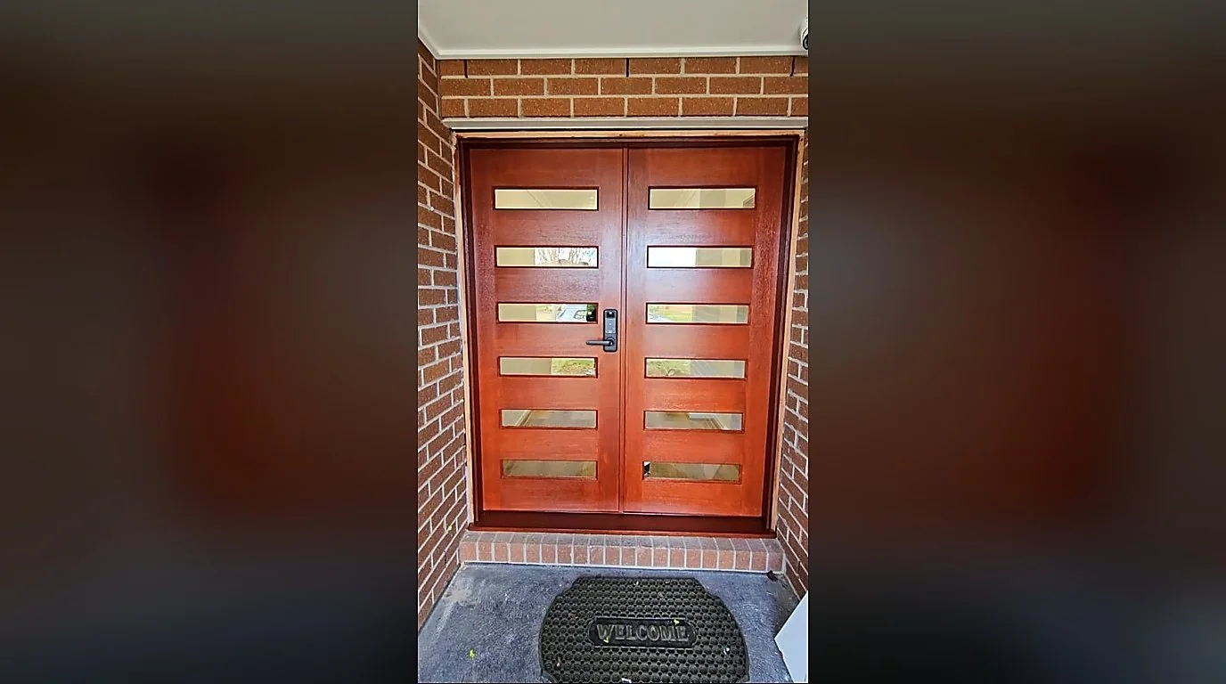 Rich jarrah timber stain on double entrance doors by Shreeji Painting